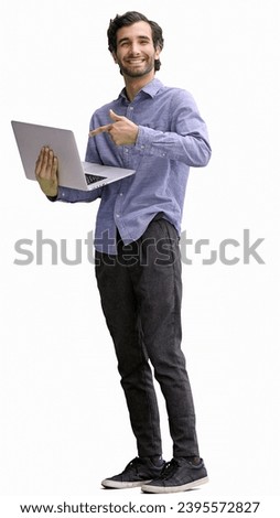 young man in full growth. isolated on white background using laptop