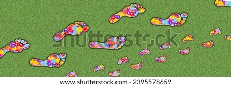 Footprints of an adult man and a child as symbol for Carbon Footprint