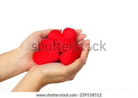 hands holding red hearts