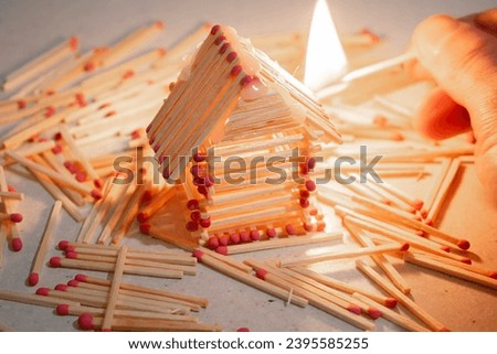 The house model is made of matches. Fire hazard concept.