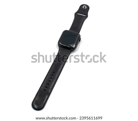 Black smart watch with a broken screen on a white background.