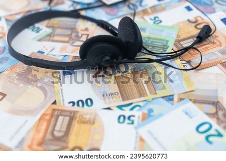 euro banknotes headphones headset. Financial background. Different Euro banknotes. Business, finance, investment, saving and corruption concept.