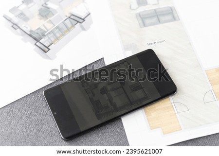 website wireframe sketch and programming code on smartphone