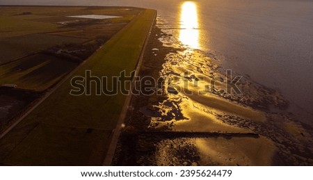 Sunset over the Wadden Sea at the coast of North Frisia - travel photography
