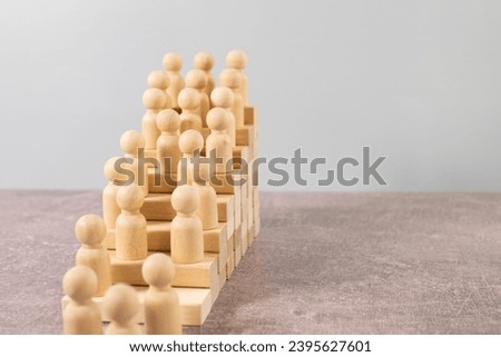 Time is money idea. time concept with business man trying to outrun time. Make things better - Improvement Concept. wooden figure - man climbing the steps to success in image over white background