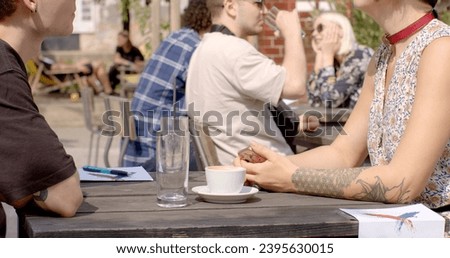 Gestures enhance spoken language, young people body details. Close-up hands during discourse time. Gesture nonverbal form of communication during conversation that convey meanings, emotions, ideas. Royalty-Free Stock Photo #2395630015