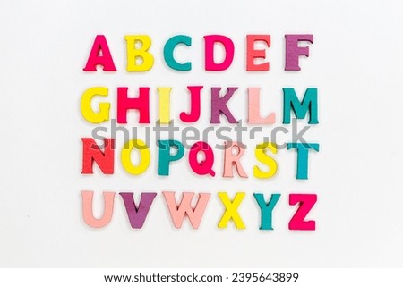 COLORFUL ALPHABET MADE OF WOODEN BLOCKS MADE
