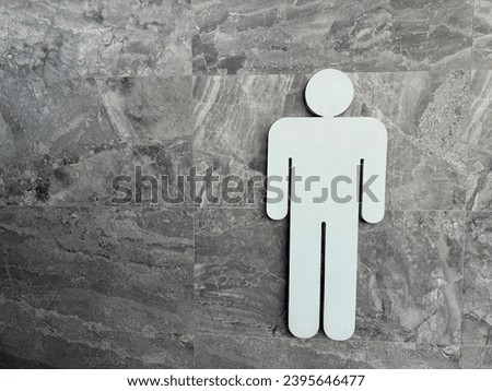 toilet signs. Men restroom icon in stone wall background, men and women bathroom white sign.