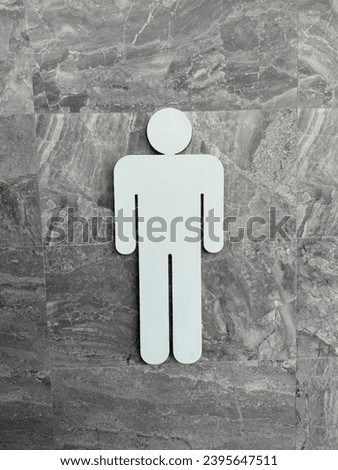 toilet signs. Men restroom icon in stone wall background, men and women bathroom white sign.