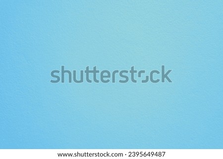 The background is blue-green with lights in the corners of the picture.
