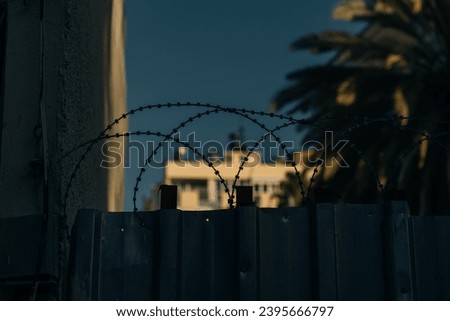 barbed wire in a residential area. safety. High quality photo