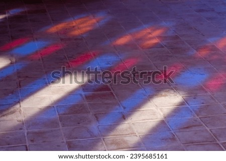 A mesmerizing play of light and color in the midst of the stained glass windows of traditional Iranian houses. The windows are a testament to the craftsmanship and artistry of the Iranian people.... Royalty-Free Stock Photo #2395685161