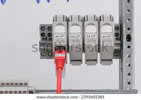 Connecting an Ethernet switch using patch cords with RJ45 connectors for data transmission in the data center. Royalty-Free Stock Photo #2395692381