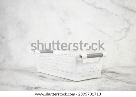 Clean and elegant white utility basket. Isolated for effortless background removal. Upgrade your listings with this pristine essential.