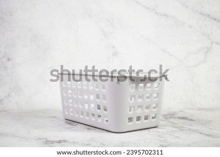 Sophisticated gray utility basket. Isolated for easy background removal. Enhance your product presentation with this versatile essential.