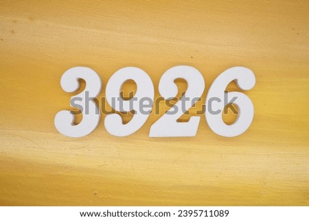 The golden yellow painted wood panel for the background, number 3926, is made from white painted wood.