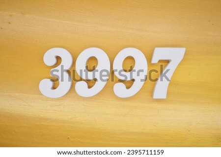 The golden yellow painted wood panel for the background, number 3997, is made from white painted wood.