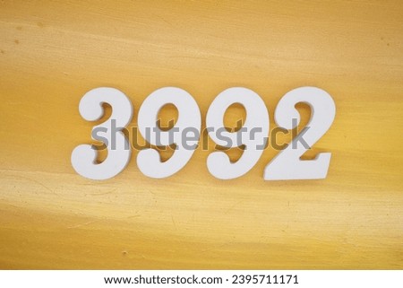 The golden yellow painted wood panel for the background, number 3992, is made from white painted wood.