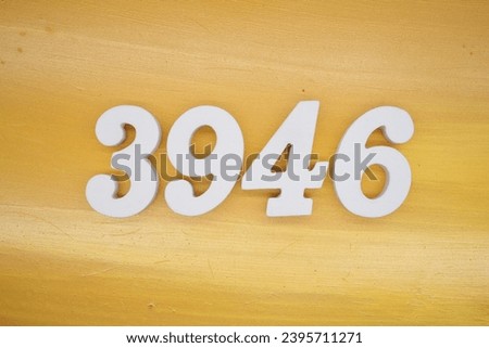 The golden yellow painted wood panel for the background, number 3946, is made from white painted wood.