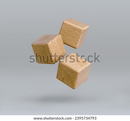 Wooden blocks flying over gray background. Free space for business concept template