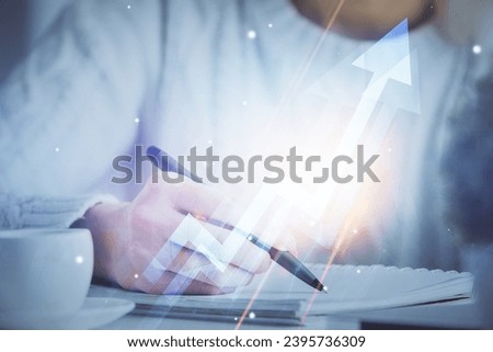 Blue arrow over woman's hands taking notes background. Concept of success. Double exposure