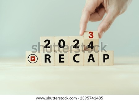 2023 Recap economy, business, financial concept. Business plan in 2024. RECAP words and 2023, 2024  on wooden cubes on smart grey background and copy space.