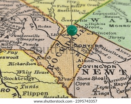 Rockdale County, Georgia marked by a green tack on a colorful vintage map. The county seat is located in the city of Conyers, GA. Royalty-Free Stock Photo #2395743357