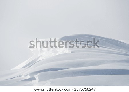 Large white snow drift cornice winter landscape Royalty-Free Stock Photo #2395750247