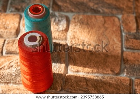 Tailoring supplies, two spools of thread. Red, blue                               
