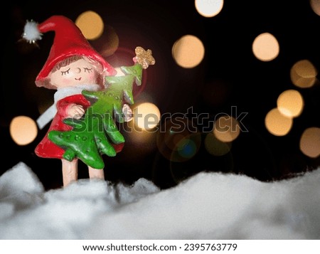 Christmas Background with Copy Text and Decoration Girl Holding Tree | Background Lights Bokeh | December Snow Royalty-Free Stock Photo #2395763779