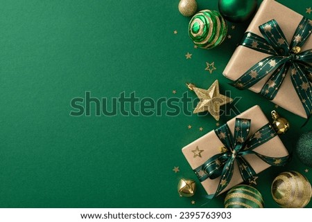 Luxurious festive display. Overhead perspective of handcrafted paper gift boxes, ornate baubles, sparkling star ornament, gold confetti arranged on a green surface, offering space for promotional text