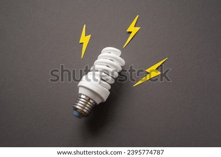 Light bulb with energy lightings on black background. Idea concept. Energy and electricity. Innovation and thinking out the box symbols. Creativity and inspiration