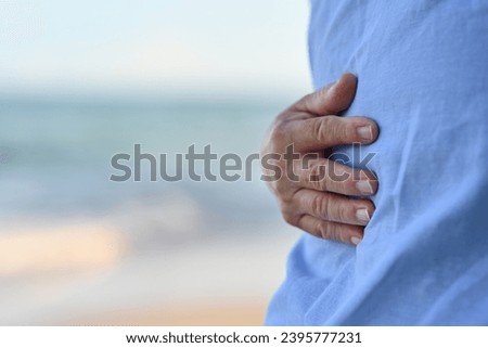 Cropped image of An Elderly couple hugging each other happily, Relax and enjoy at the seaside beach.