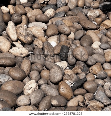 a photography of rocks on the beach.