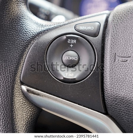 the interior of a car with the steering wheel and dashboard.