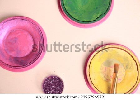 paints and brushes are different colors