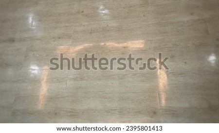 A perspective view of wooden shade glittering like hardwood tile flooring lighting reflection for office room. Close up interior view of wooden parquet floor. 