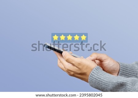Customer touch mobile phone give five star for rating. Service rating, feedback, satisfaction concept