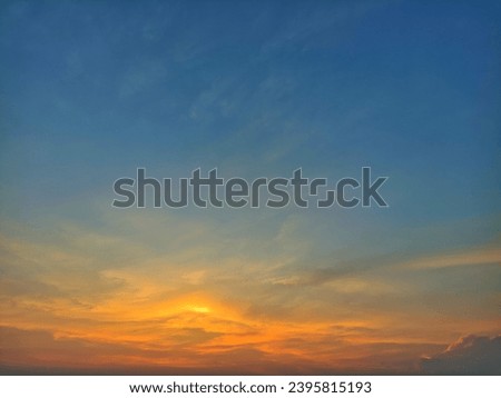 The beautiful clear sky painted by the sun leaves a bright golden hue. Thick clouds in the dusk sky on a winter afternoon. Image of clear sky in the afternoon.