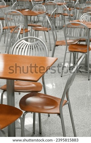 Empty cafe or restaurant, rows of tables and chairs, perspective point of view