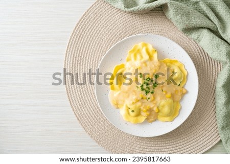 ravioli pasta with corn cheese sauce on plate