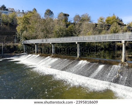 Hiker's point of view along the Corgo river city park in Vila Real, Portugal. Royalty-Free Stock Photo #2395818609