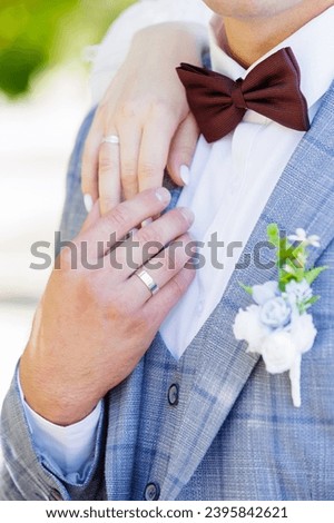 Newlyweds' hands in wedding rings
