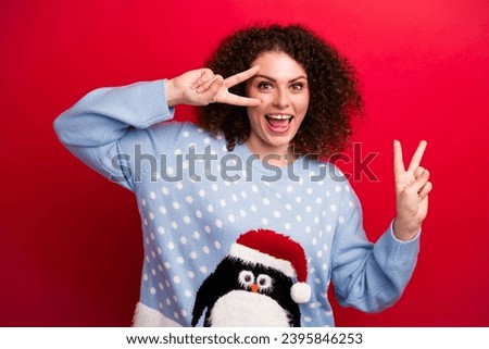 Portrait funky young positive lady wearing blue sweater show v sign cover face symbol of peace in ukraine isolated on red color background