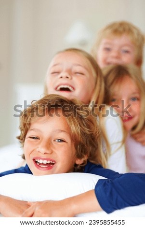 Portrait, love or laughing with brother and sister sibling children on a bed in the home together. Family, happy or bonding with funny boy and girl kids in the bedroom of an apartment on the weekend Royalty-Free Stock Photo #2395855455