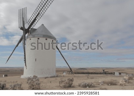 Photo of some beautiful and historical windmills located in Consuegra, Toledo, Spain during a sunny day of summer in a natural place.