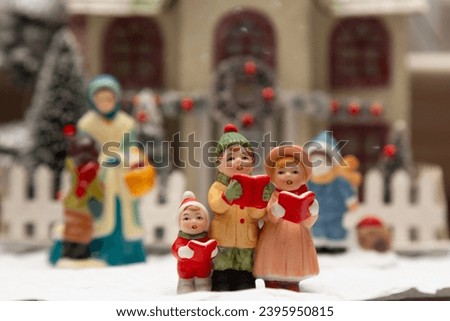 Christmas village singing caroler figurines