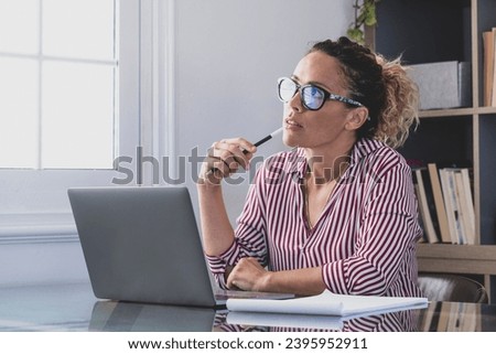 Caucasian reflexive looking at laptop screen, reflexing on work, businesswoman independent working in a difficult project. Female person preparing at home in the office indoor. Royalty-Free Stock Photo #2395952911