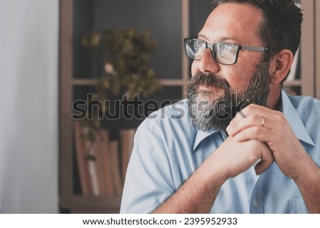 Caucasian reflexive looking at laptop screen, reflexing on work, businessman independent working in a difficult project. Male person preparing at home in the office indoor. Royalty-Free Stock Photo #2395952933