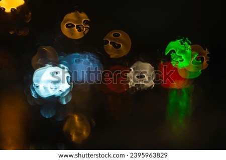 Drops of water and rain on glass, abstract look. night city bokeh. Graphic resource, background